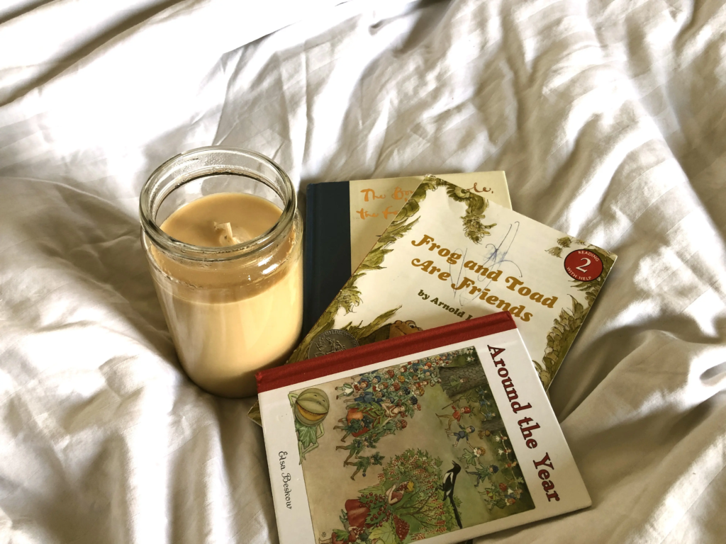 Cup of tea and open books on wooden table representing self-reflection and the journey to rediscover yourself